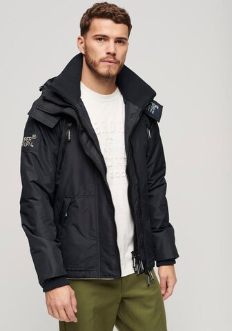 Veste mi-saison Superdry en bleu : devant
