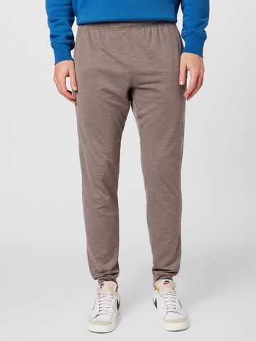 Effilé Pantalon de sport NIKE en beige : devant