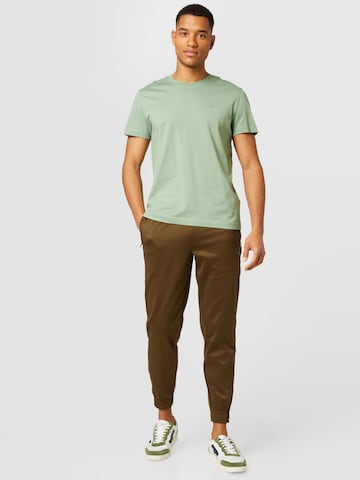 PUMA Zúžený Sportovní kalhoty – zelená