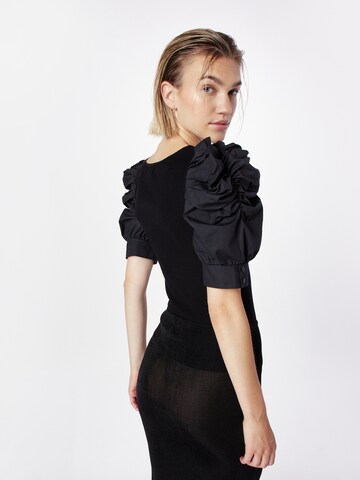 River Island - Jersey en negro