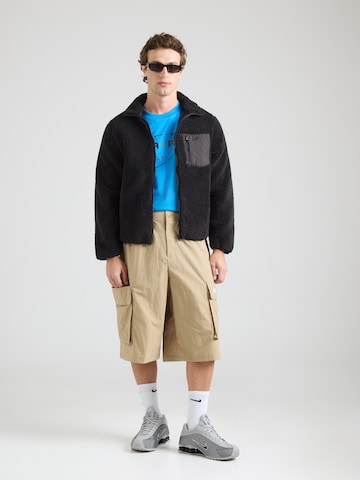 Loosefit Pantaloni 'CLUB' di Nike Sportswear in beige
