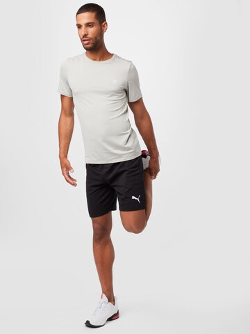 PUMA - Regular Calças de desporto 'TeamRise' em preto