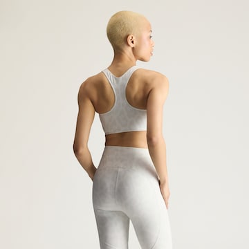 Bustino Reggiseno sportivo 'PrimeLiftImpact' di ADIDAS BY STELLA MCCARTNEY in bianco