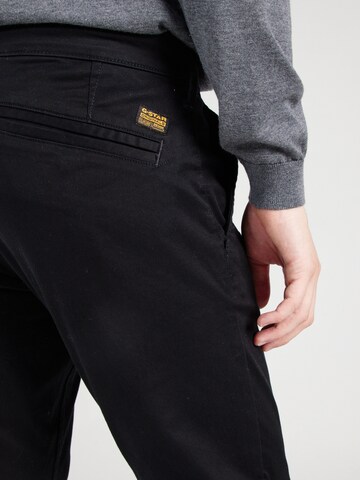 Skinny Pantaloni chino di G-STAR in nero