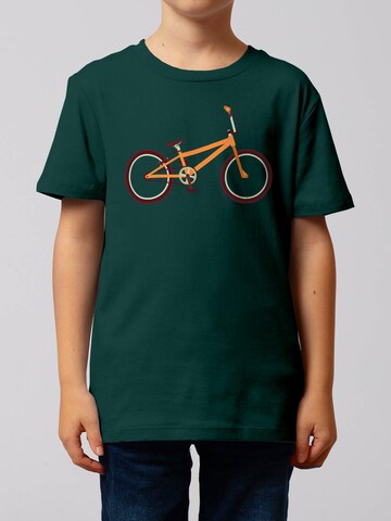 watabout.kids T-Shirt 'Bmx' in Grün: Vorderseite