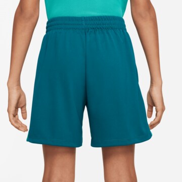 NIKE Loose fit Sports trousers in Blue