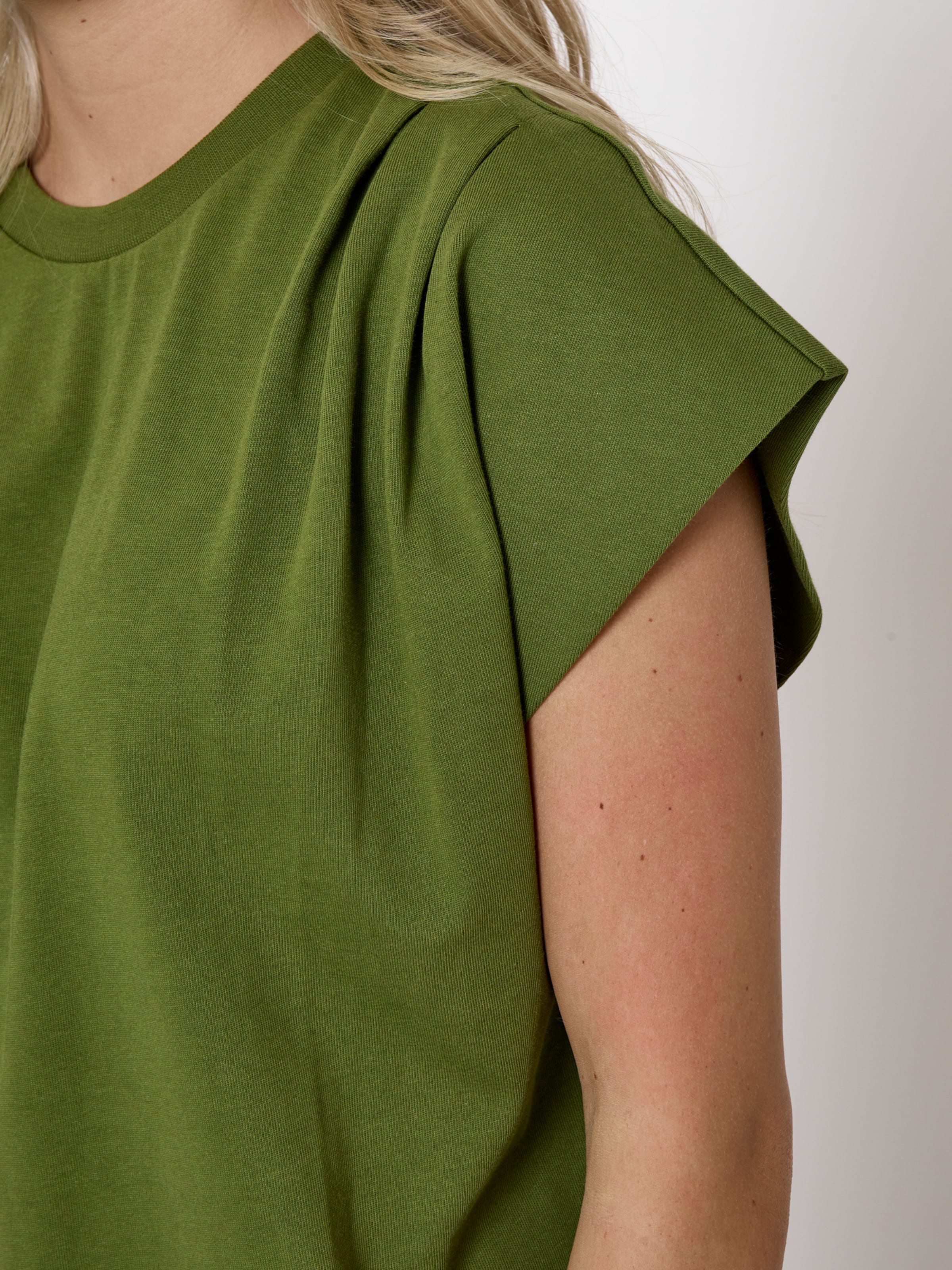 Top di minus in verde