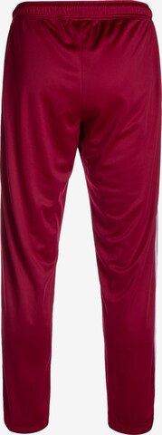 Loosefit Pantaloni sportivi 'DMWU Evolution' di Unfair Athletics in rosso