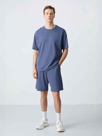 Tommy Life Tracksuit in Blue: front