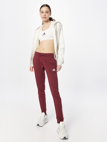 Effilé Pantalon de sport 'Essentials' ADIDAS SPORTSWEAR en rouge