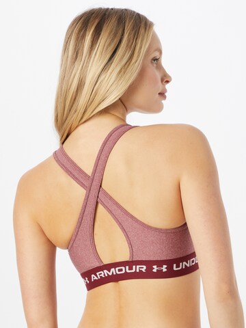 Bustier Soutien-gorge de sport UNDER ARMOUR en rouge