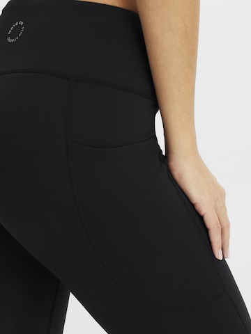 bonprix Skinny Sporthose in Schwarz