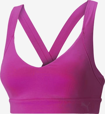 PUMA Medium Support Sports bra 'Own It' in Pink: front