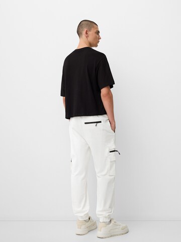 Bershka Tapered Cargo trousers in White