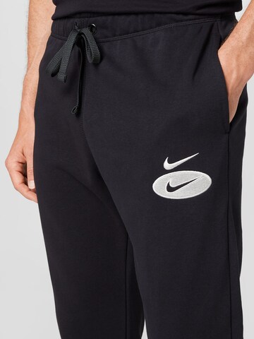 Tapered Pantaloni de la Nike Sportswear pe negru