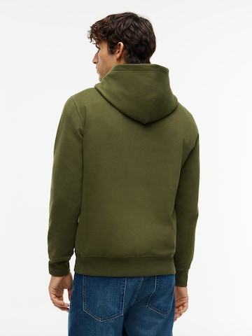 TOMMY HILFIGER Collegepaita 'ESS SEASONAL' värissä vihreä