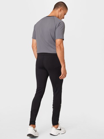 FILA Slim fit Workout Pants 'RATSCHINGS' in Black