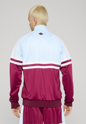 Giacca per l'allenamento 'DMWU' di Unfair Athletics in rosso