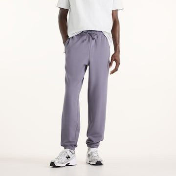 Pantaloni 'Athletics French Terry Jogger' di new balance in lilla: frontale