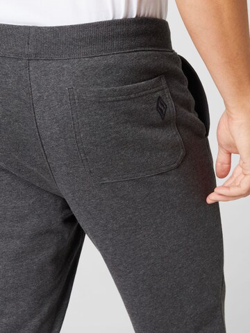 SKECHERS Tapered Sports trousers in Grey