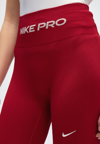 NIKE Kitsas Spordipüksid 'Pro', värv punane