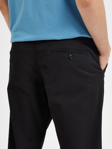 Slimfit Pantaloni '16087663' di SELECTED in nero
