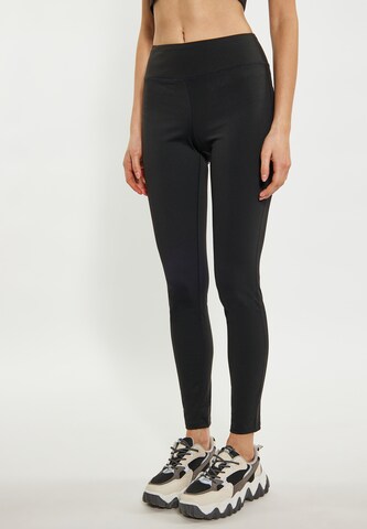 TUFFSKULL - Skinny Leggings em preto: frente
