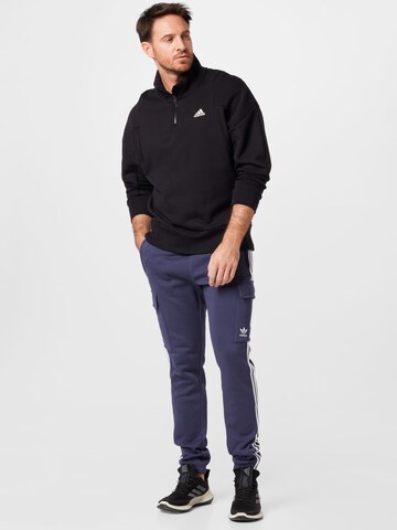 Tapered Pantaloni di ADIDAS ORIGINALS in blu