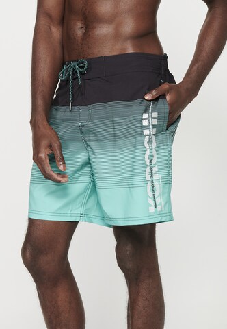 KOROSHI Board Shorts in Green: front