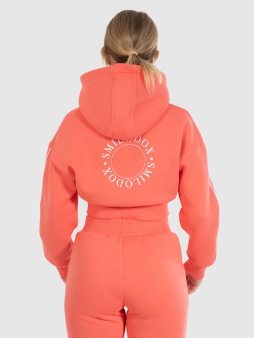 Veste de survêtement ' Maren ' Smilodox en orange