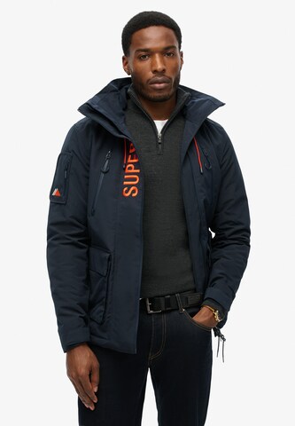 Veste mi-saison 'Ultimate' Superdry en noir : devant