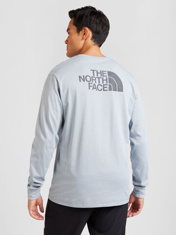 THE NORTH FACE - Camisa em azul: frente