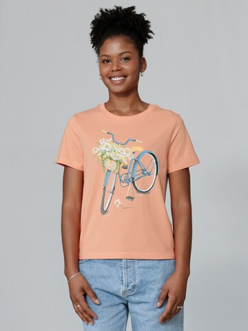 Watapparel T-Shirt ' Blaues Damenrad ' in Orange: Vorderseite