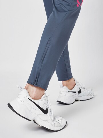 NIKE Slim fit Workout Pants in Blue