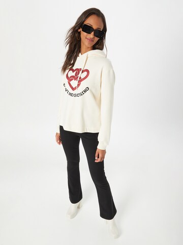 Love MoschinoSweater majica 'FELPA' - bež boja