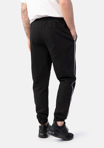Effilé Pantalon de sport Hero en noir