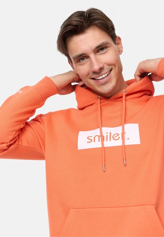 smiler. Sweatshirt in Orange