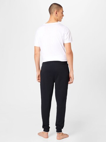 Tapered Pantaloni de la BOSS pe negru
