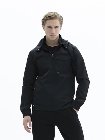Veste de survêtement 'KOMO' SCR. en noir : devant