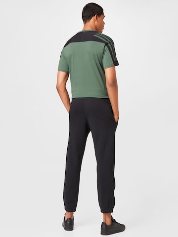 ADIDAS SPORTSWEAR Tapered Workout Pants 'Essentials Feelvivid  Fleece Straight' in Black