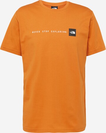 THE NORTH FACE T-shirt 'NEVER STOP EXPLORING' i brun: framsida