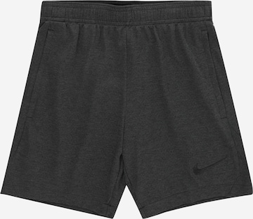 NIKE Regular Workout Pants in Black: front