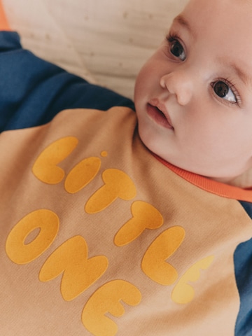 Tutina / body per bambino di Next in beige