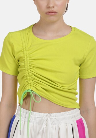 myMo ATHLSR - Camiseta funcional en amarillo