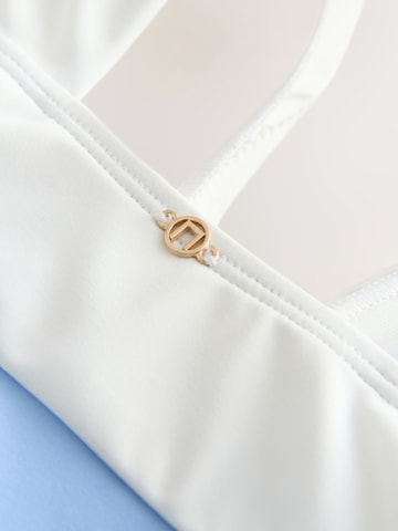 Costum de baie modelator de la Next pe albastru