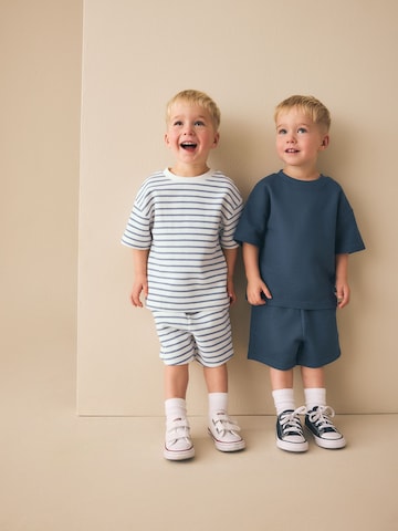 Set di Next in blu: frontale