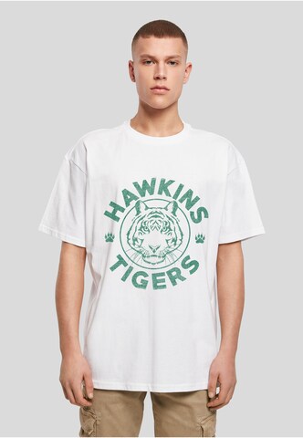 Merchcode Tričko 'Stranger Things Hawkins Tigers' – bílá: přední strana