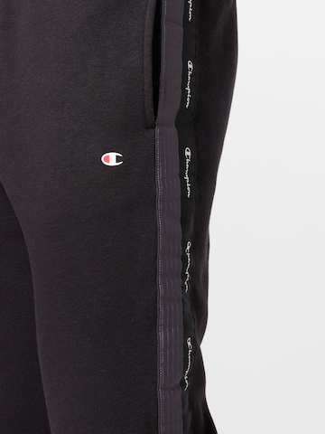 Champion Authentic Athletic Apparel Zwężany krój Spodnie w kolorze czarny