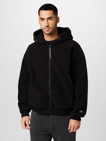 LEVI'S ® Fleece Jacket 'Sherpa Full Zip Hoodie' in Black: front