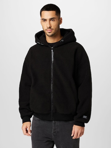 LEVI'S ® Fleece jacket 'Sherpa Full Zip Hoodie' in Black: front